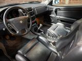 a car dashboard with a steering wheel and a dash board