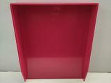 pink plastic shelf with a red lid on a white surface