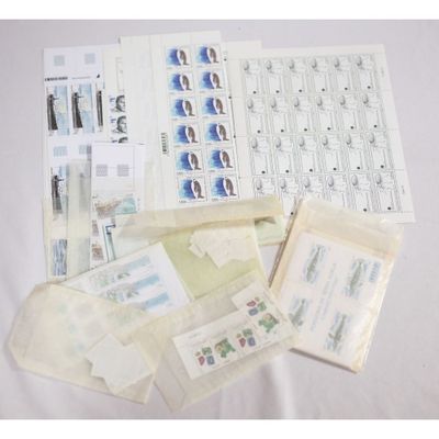 a lot of stamps and envelopes on the table