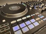 a dj controller that is sitting on top of a table