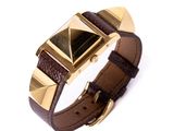 brown leather watch band with gold pyramids on a white background