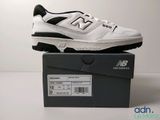 the new balance shoes are in the box on the table
