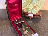 a case with a watch inside of it on a table