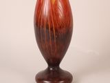 a vase that has a red and yellow design on it