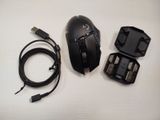 a picture of a computer mouse and charger on a table