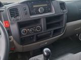 a dashboard of a car with a steering wheel and dashboard controls