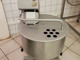 a machine that is sitting on the floor in a kitchen