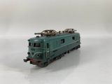 a toy train on a white surface with a white background