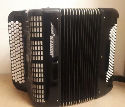 an image of a black accordion sitting on top of a table
