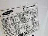 a close up of a white refrigerator with a sticker on it
