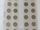 some coins are in a plastic bag on a white surface