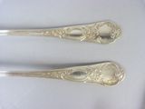 two spoons that are sitting on a table