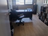 a room with a desk and a chair in it