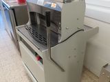 an image of a commercial coffee machine in a kitchen