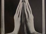 a black and white photo of a person praying