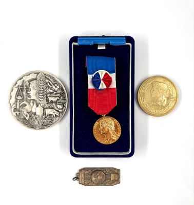 a medal and a coin sitting next to each other on a table