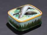a small box with a picture of two dolphins on it