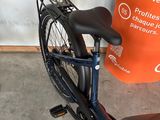 a bicycle that is parked next to an orange sign