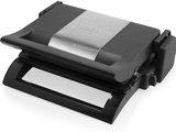 a close up of a sandwich maker on a white surface