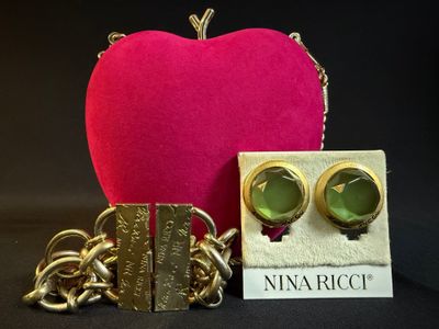 an image of a pink heart with a pair of gold earrings and a pink purse