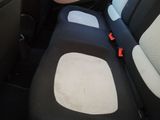 a seat in the back of a car with a seat belt