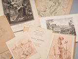 many old books on the table with drawings on them