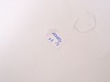 a piece of paper with a sticker on it