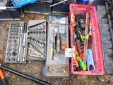 many different tools in a toolbox on the ground