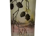 a glass vase with a picture of a tree branch on it
