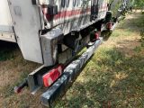 an image of a truck that is parked on the side of the road