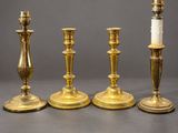 a set of four brass candlesticks