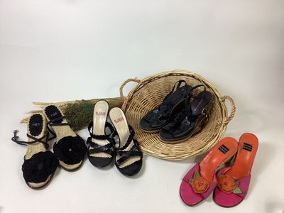 many pairs of shoes and a basket on the table