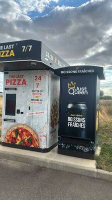two vending machines on the side of the road