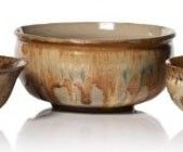 three bowls sitting next to each other on a white surface