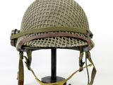 a close up of a helmet on a stand on a white background