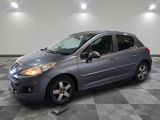 a picture of a grey car parked in a garage