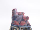 an image of a chair with a blanket on top of it