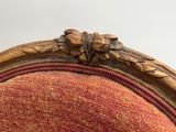 an image of a close up of a chair with a red upholstered seat