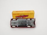 an image of a red toy car in a box on a white surface