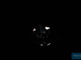 a close up of a diamond in the dark with a black background
