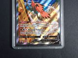 a close up of a pokemon card on a table