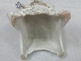 a small figurine that is sitting on a table