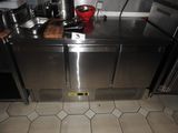 a stainless steel counter with a pot on top of it