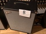 two amps sitting next to each other on a wooden floor