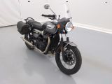 a black motorcycle that is parked in a room