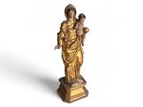 an image of a statue of a woman holding a child