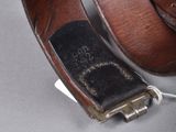 a brown leather belt with a metal buckle on it
