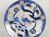 an image of a blue and white plate with birds and flowers on it