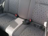 two seats in the back of a car with a seat belt