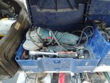 a blue tool box filled with tools on a table